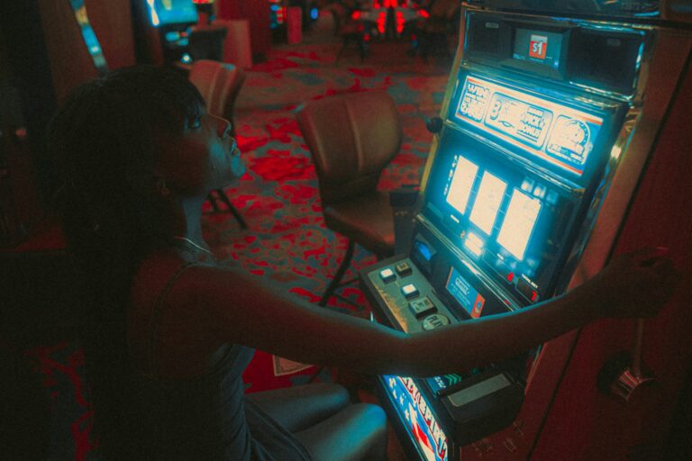 a woman playing a slot machine in a casino